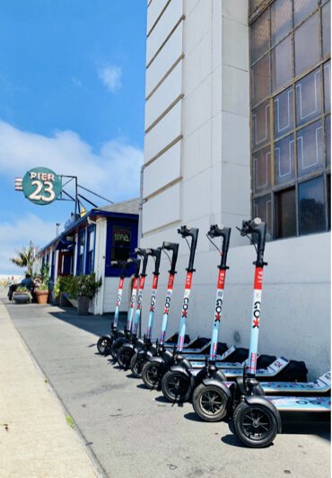 A row of Go X scooters at Pier 23